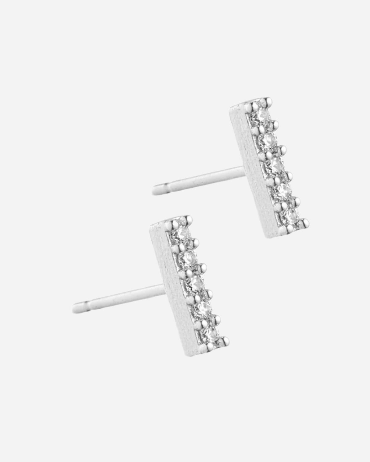 Pair of silver stud earrings with clear gemstones on a white background