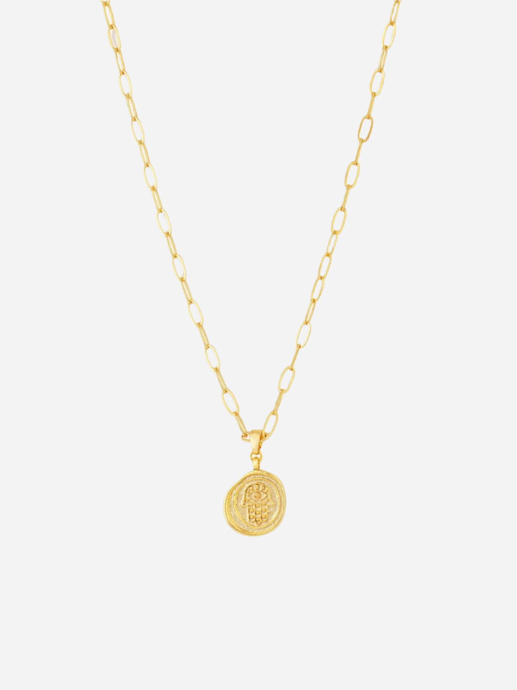 A gold-colored necklace with a hamsa hand pendant on an oval paperclip style chain.