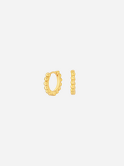 Gold hoop earrings on a white background