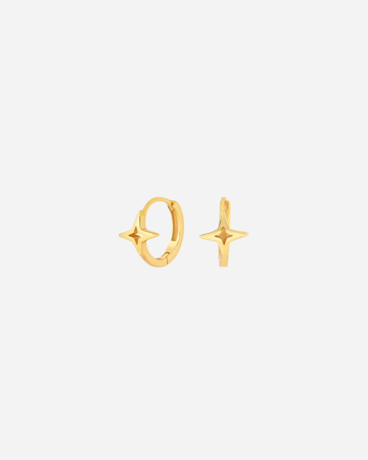 Gold hoop earrings on a white background