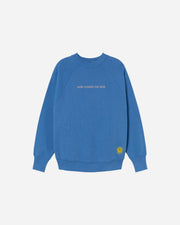 Bright blue round neck sweatshirt with HERE COMES THE SUN embroidered on the front and Sun embroidery on the bottom left side