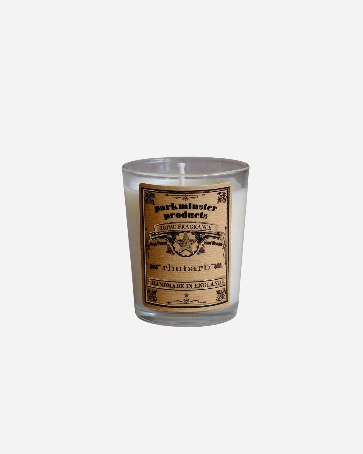 A clear glass mini votive candle with a label that reads 'Rhubarb', indicating the scent of the candle.