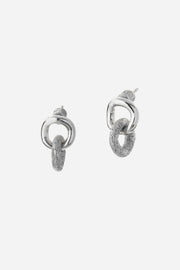 Pair of silver hoop earrings on a light gray background