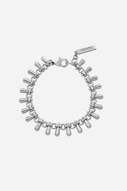 Silver bracelet with cylindrical charms on a light gray background