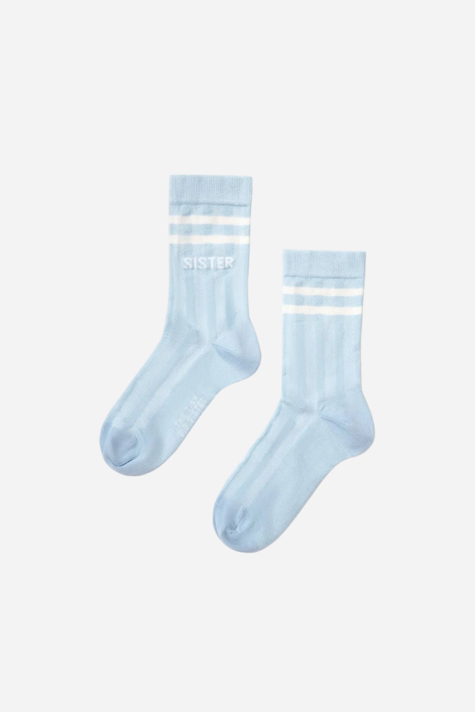 Two light blue socks with white stripes on a white background
