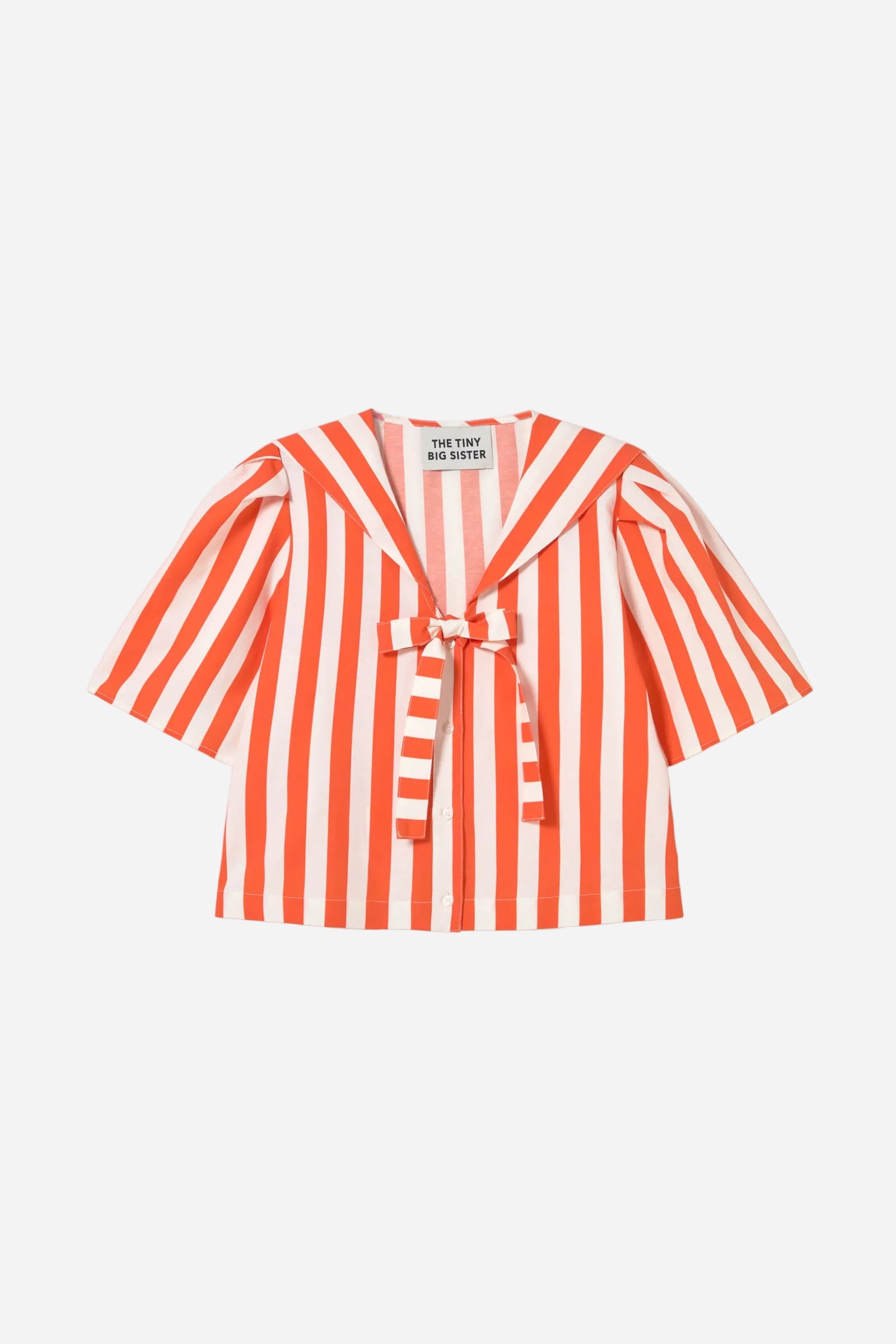 Red and white striped blouse with a knot detail on a white background
