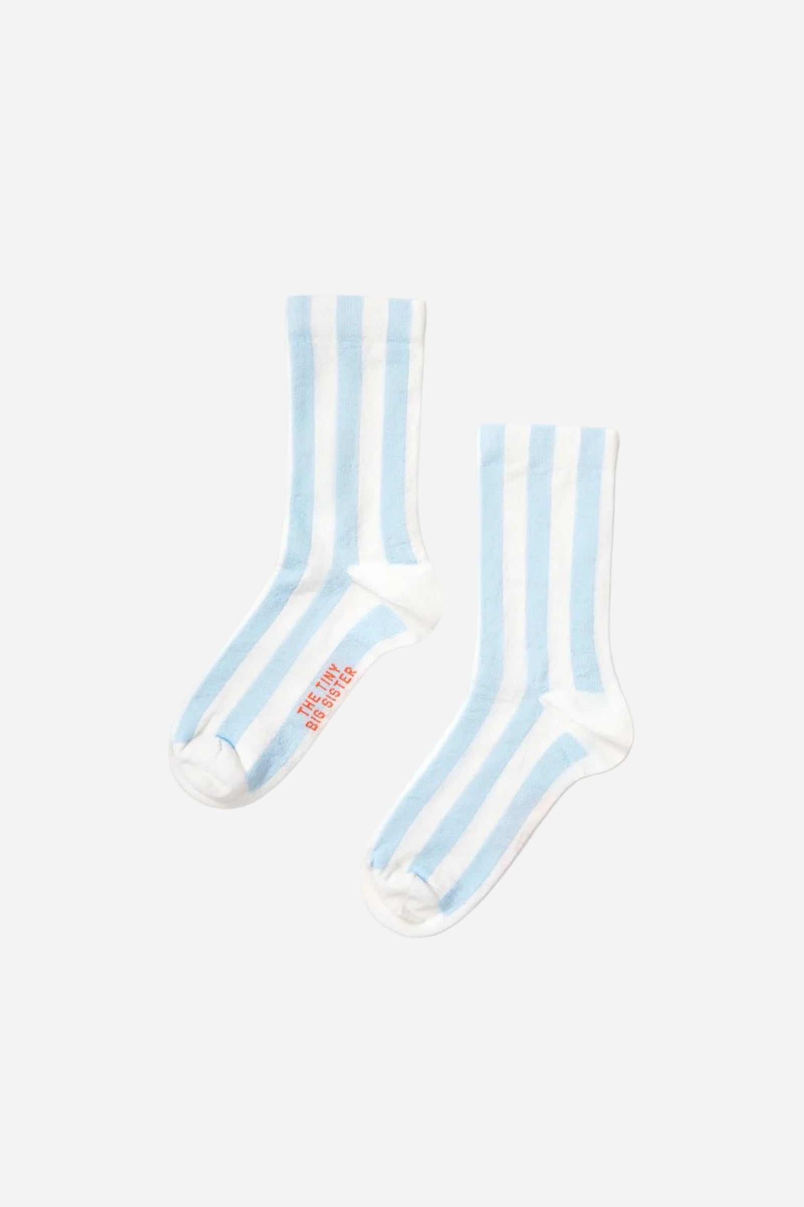 Pair of light blue and white striped socks on a white background