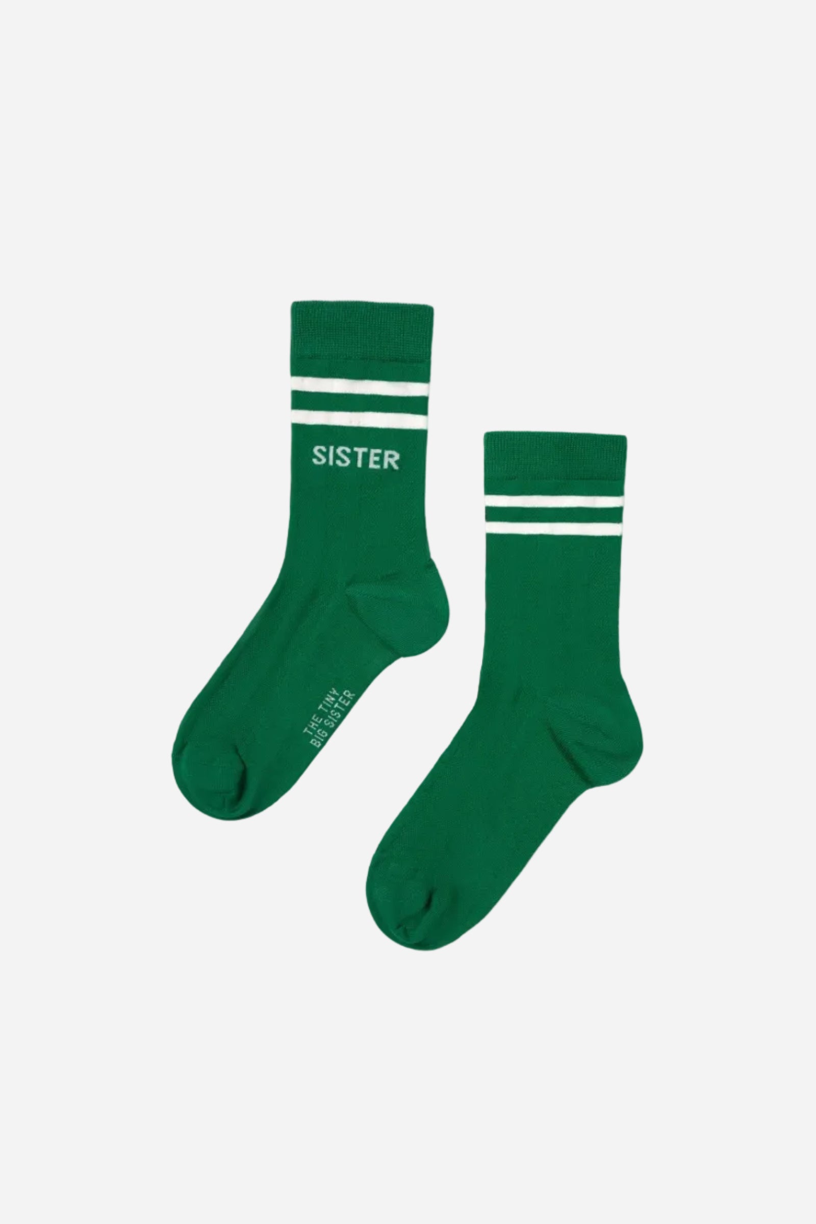 Two green socks with white stripes on a white background