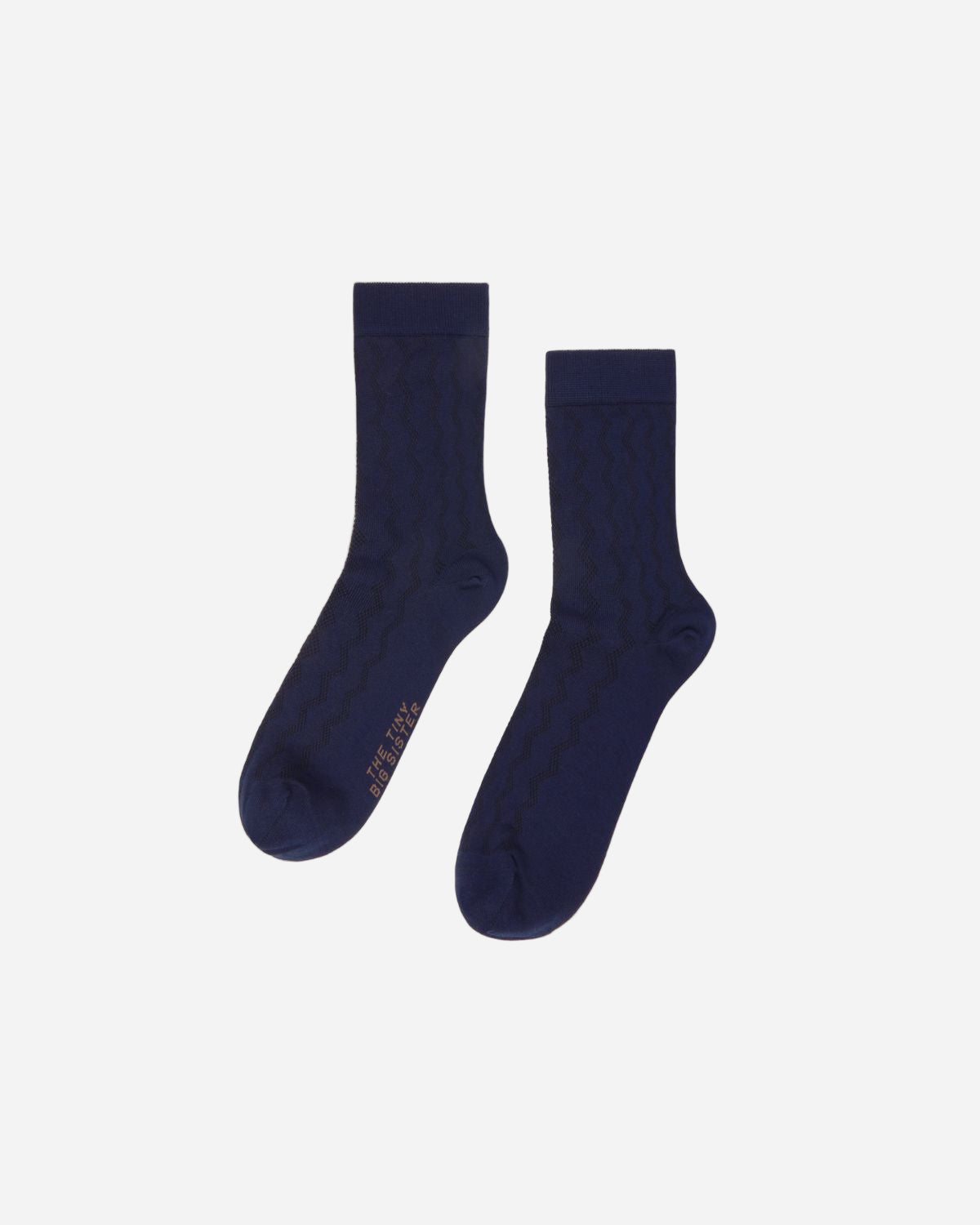 Pair of navy blue socks on a white background