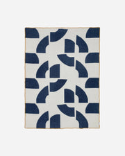 Wool blanket with blue geometric pattern on a white background