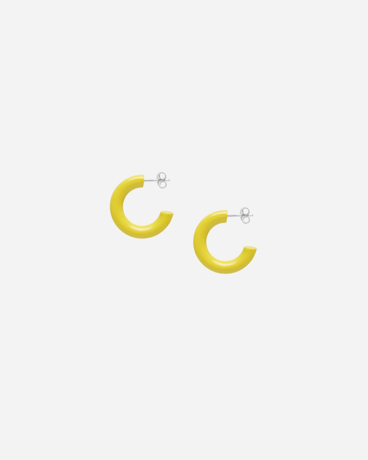 Yellow hoop earrings on a white background