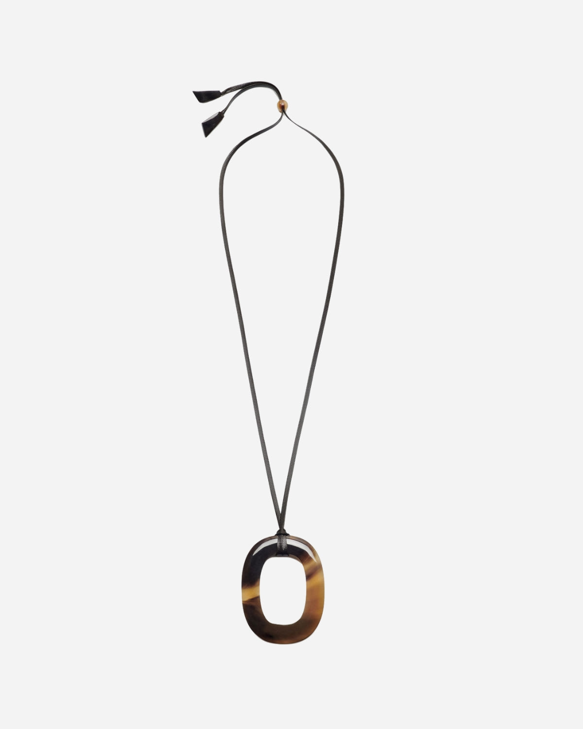 Necklace with a large oval tortoiseshell pendant on a white background