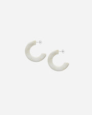 Pair of natural white hoop earrings on a white background