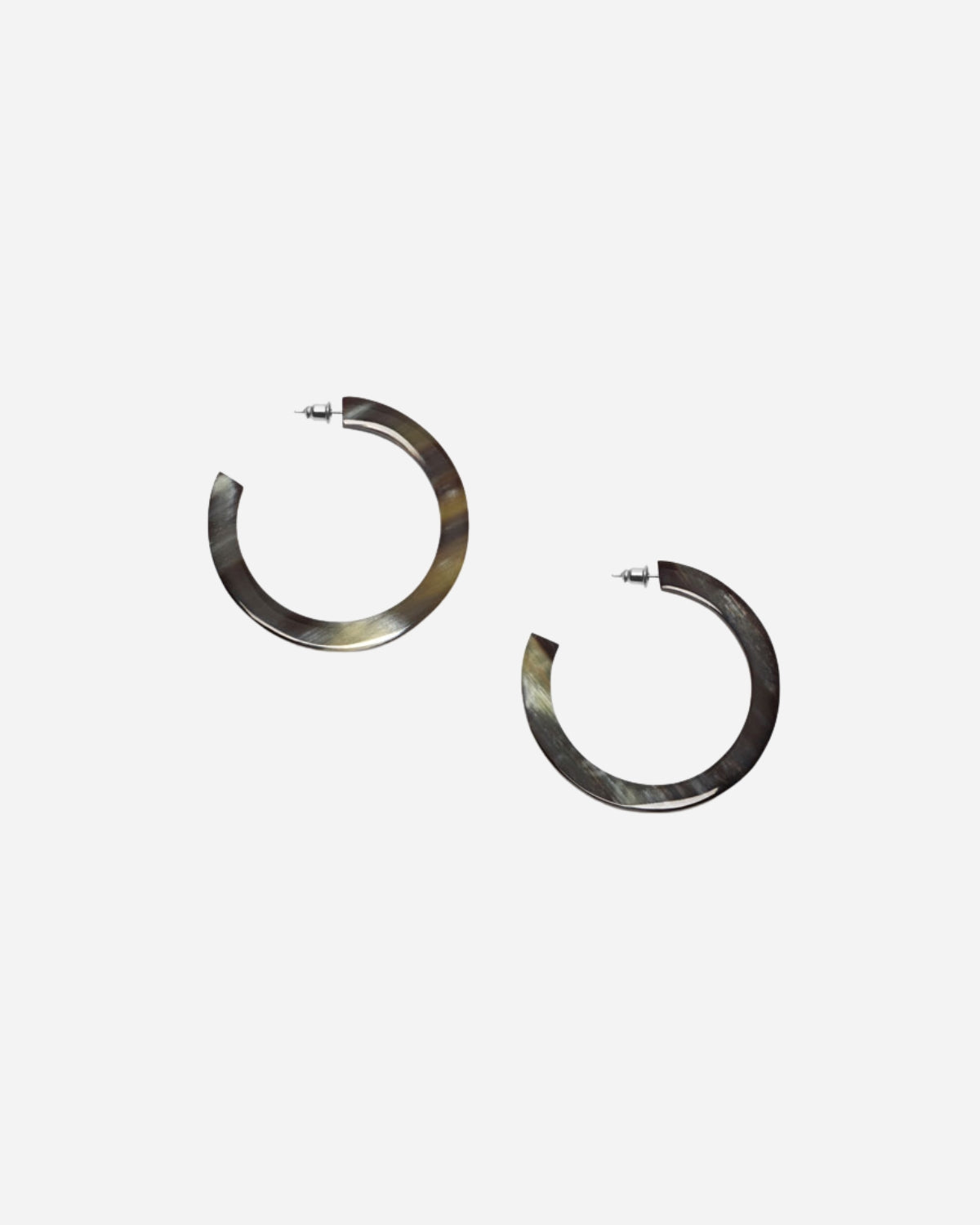 Pair of natural black 
hoop earrings on a white background