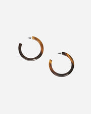 Tortoiseshell hoop earrings on a white background