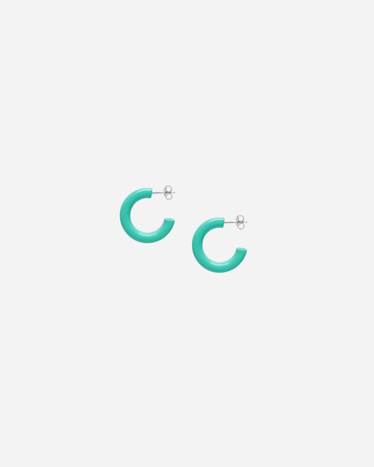 Turquoise hoop earrings on a white background