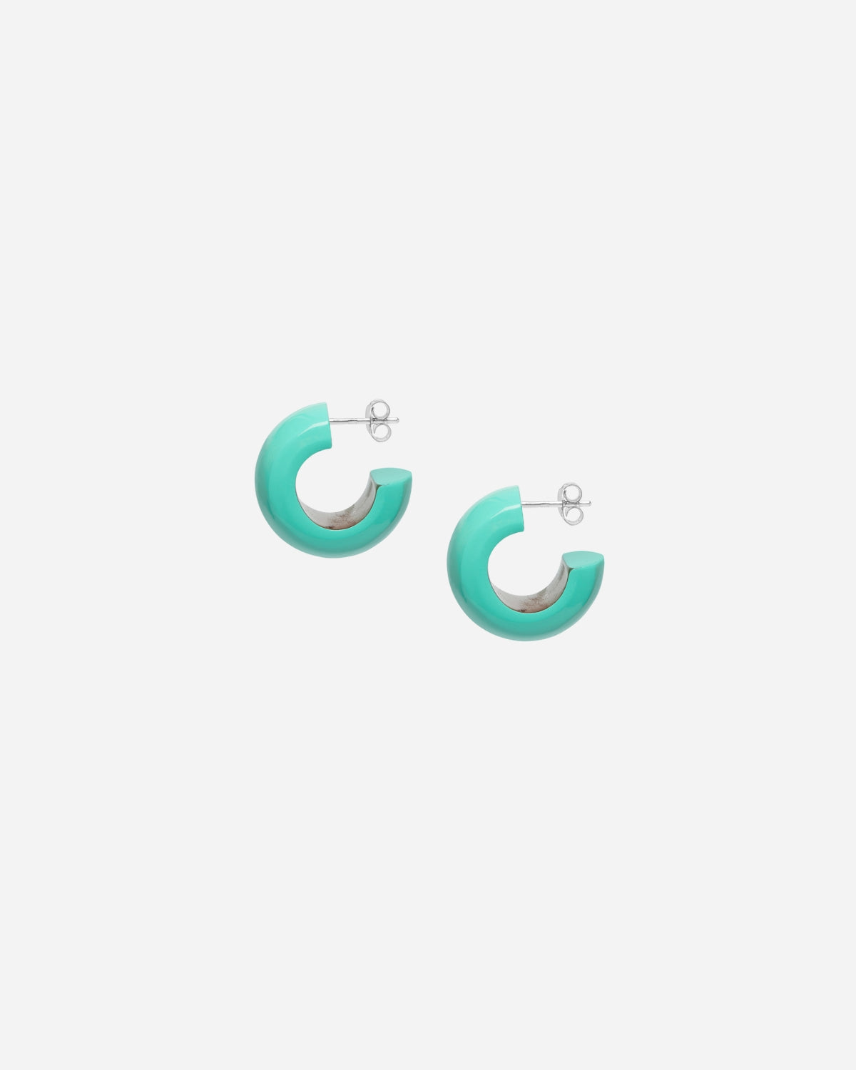 Turquoise hoop earrings on a white background