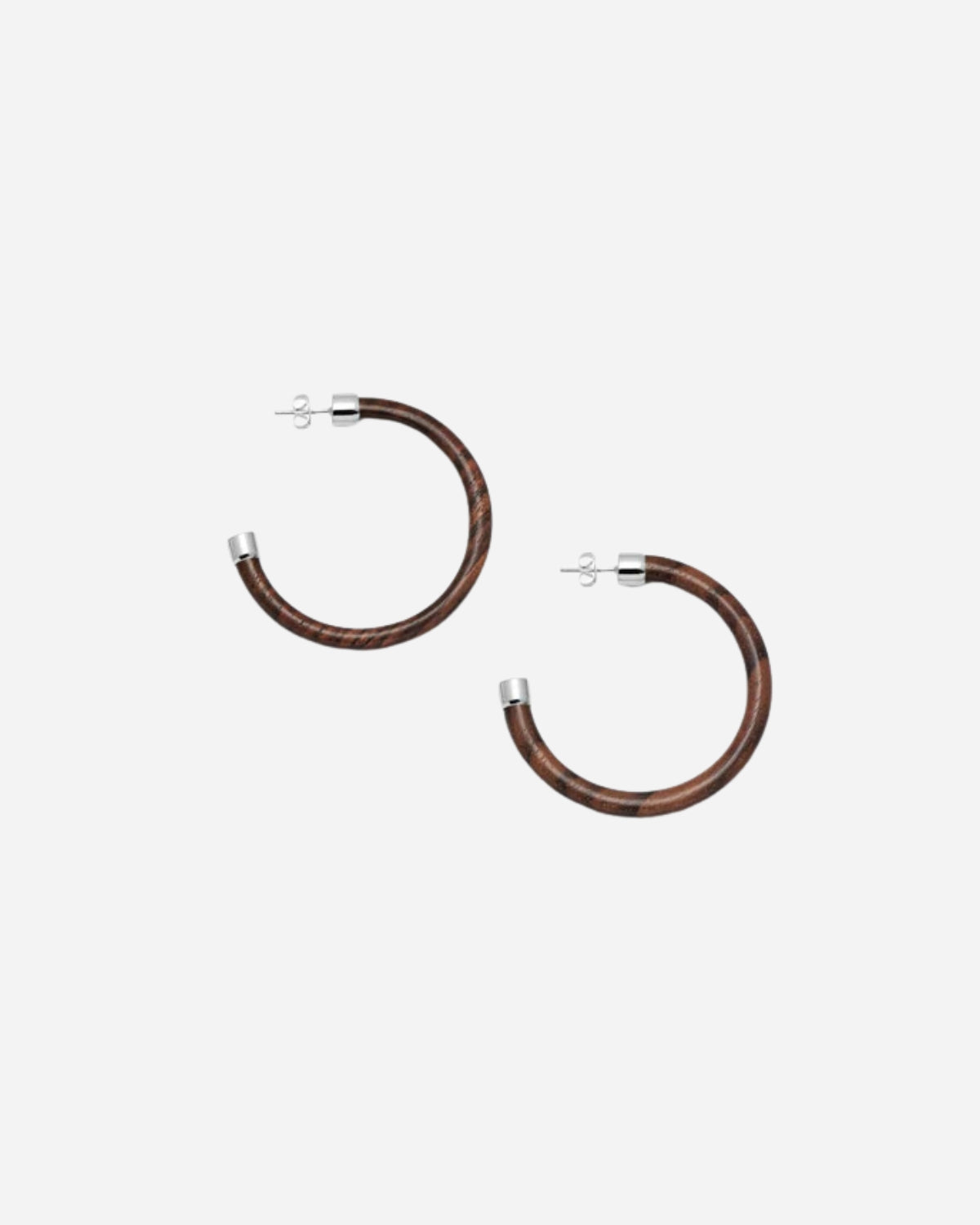 Pair of brown hoop earrings on a white background