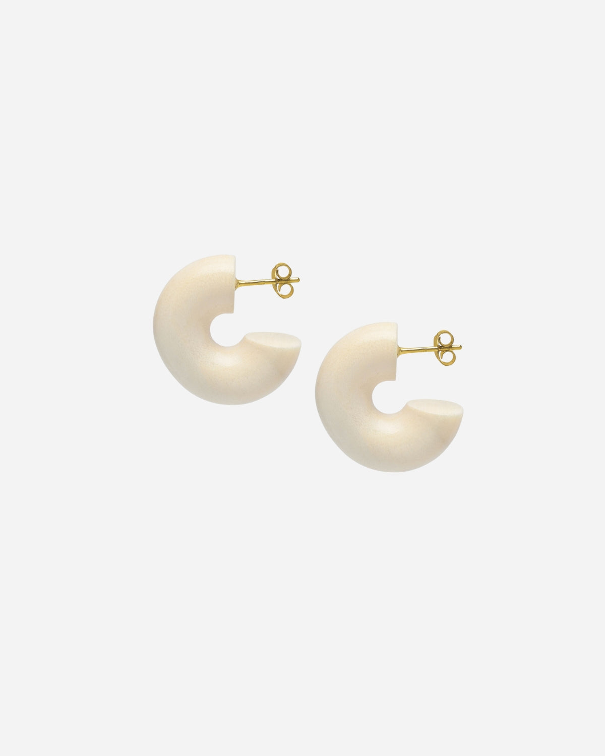Pair of white earrings with gold posts on a white background