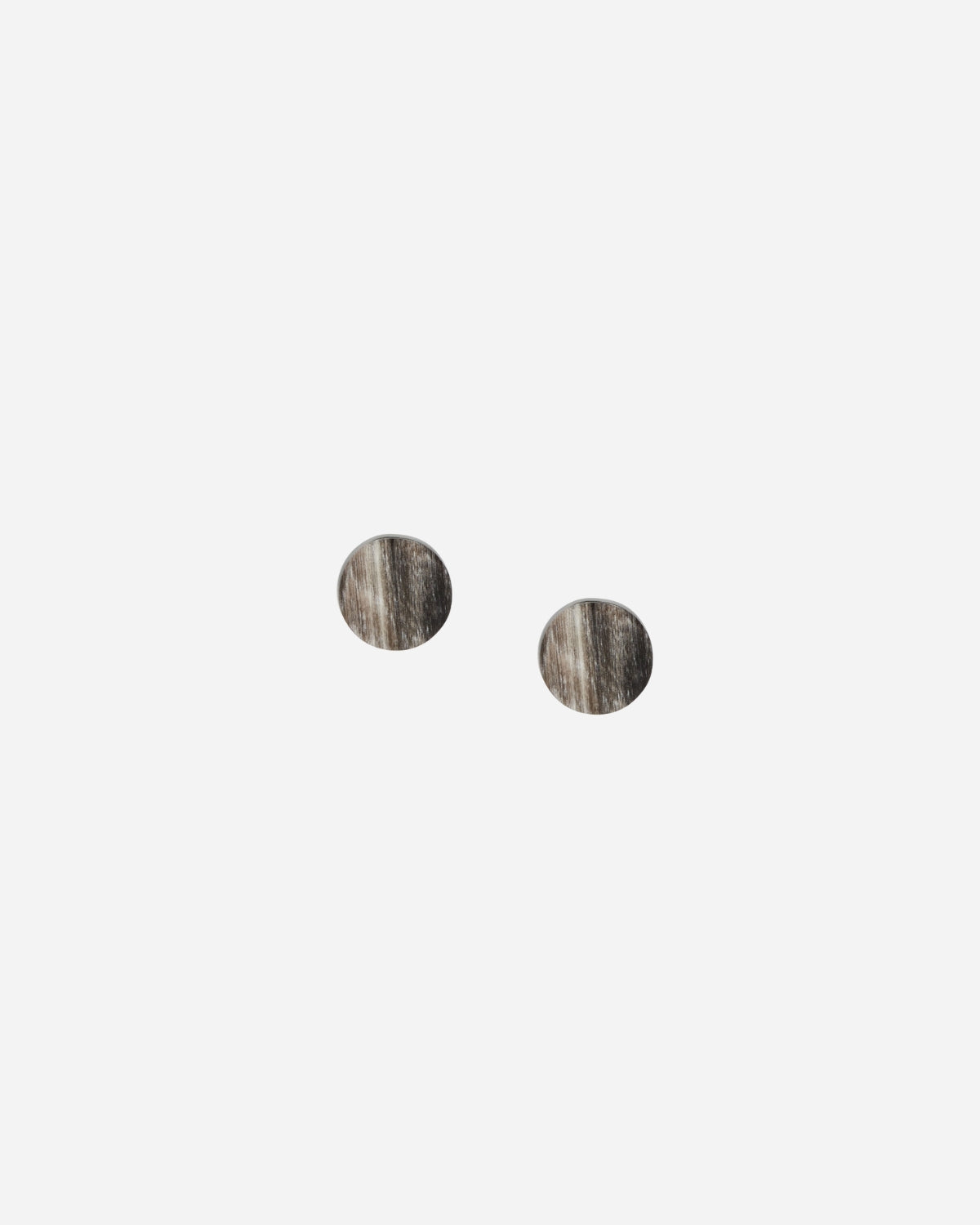 Pair of round earrings on a white background