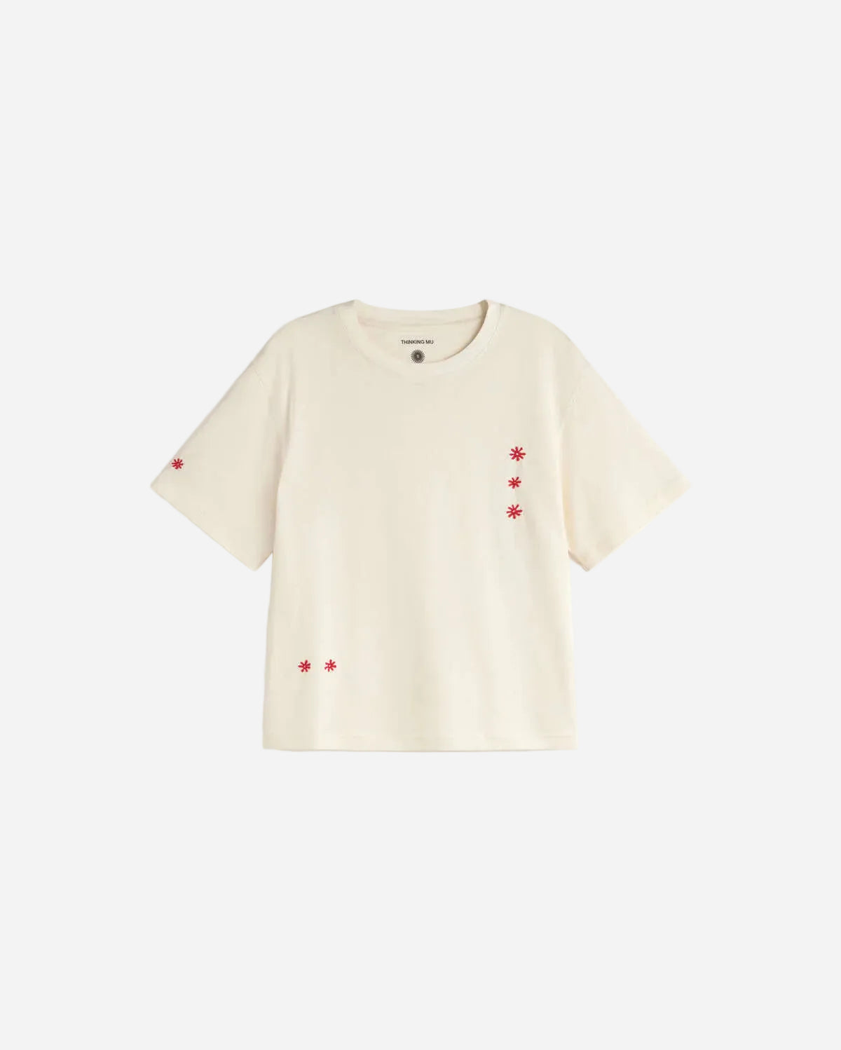 Beige t-shirt with small red floral patterns on a white background