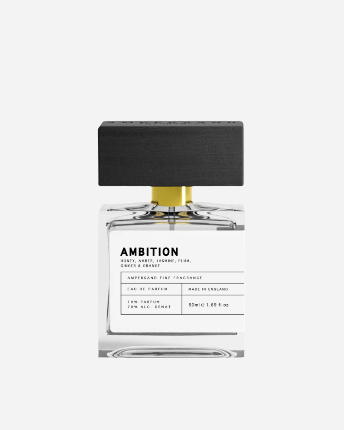 Clear perfume bottle with black and white printed label and black wooden cap with Ampersand engraving.