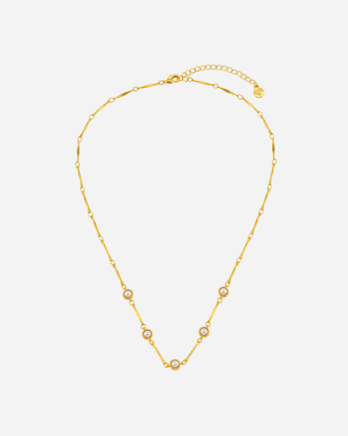 Gold necklace with small pearls on a white background