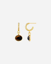 Gold hoop earrings with black stones on a white background