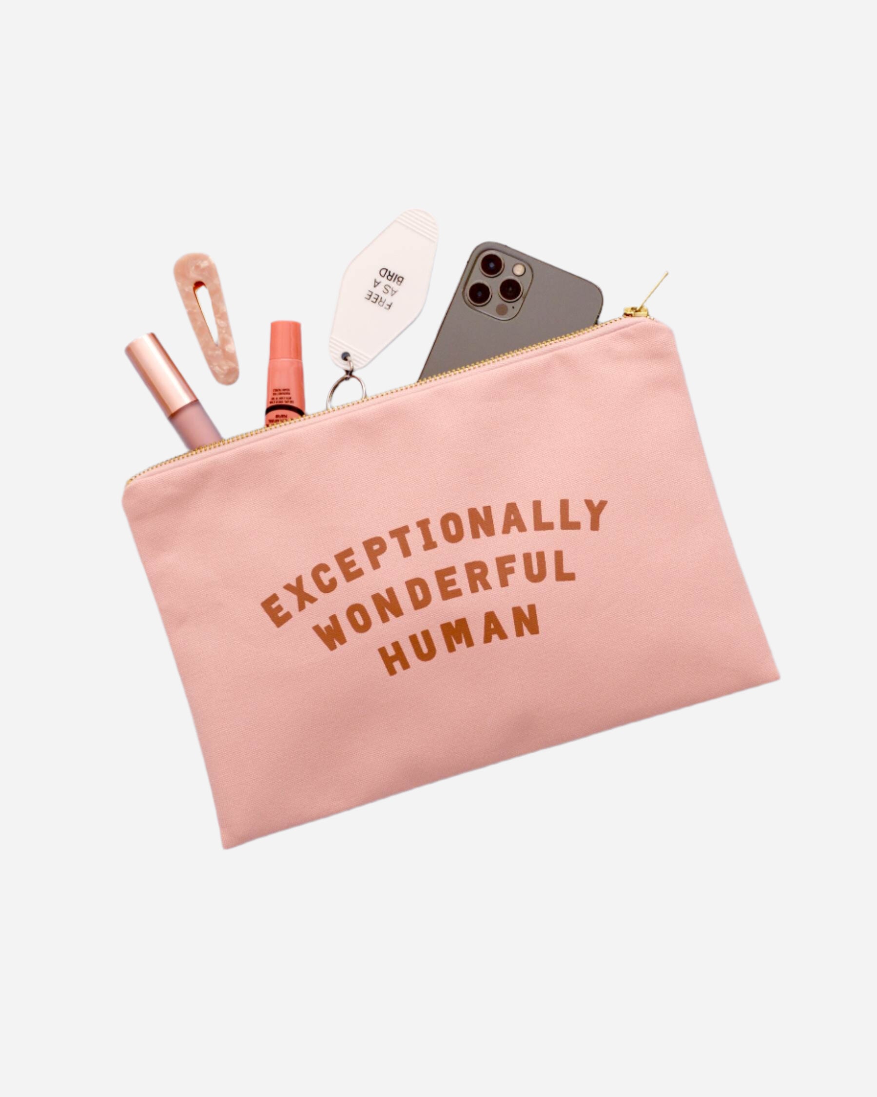 Pink canvas pouch with gold zip and EXCEPTIONALLY WONDERFUL HUMAN slogan in tan