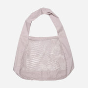Light purple net bag with a plain background