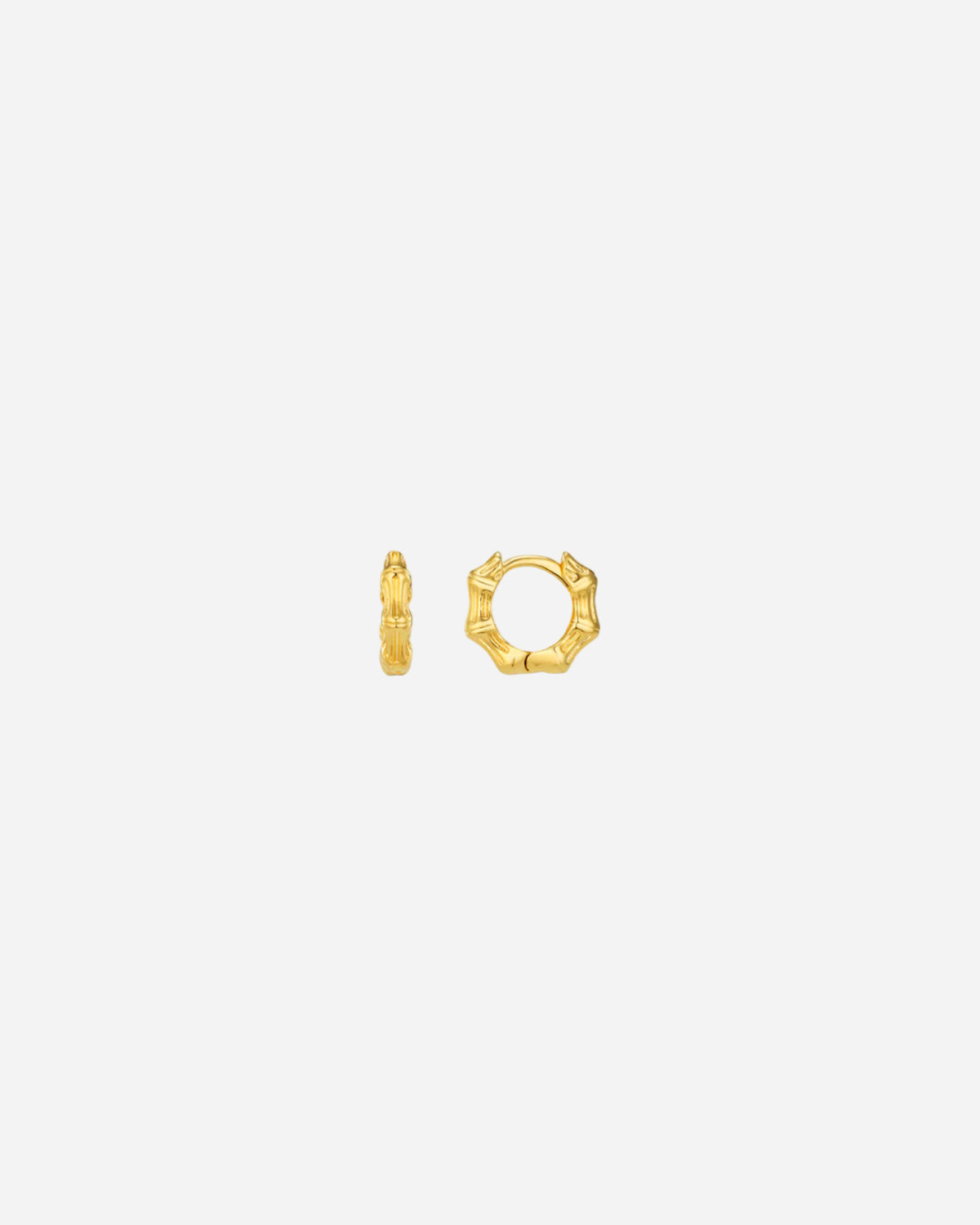 Gold hoop earrings on a white background