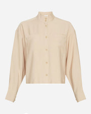 Beige shirt with a high collar on a white background