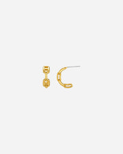 Gold earring on a white background