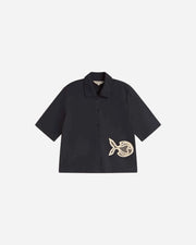 Navy shirt with a embroidered fish design on a light gray background